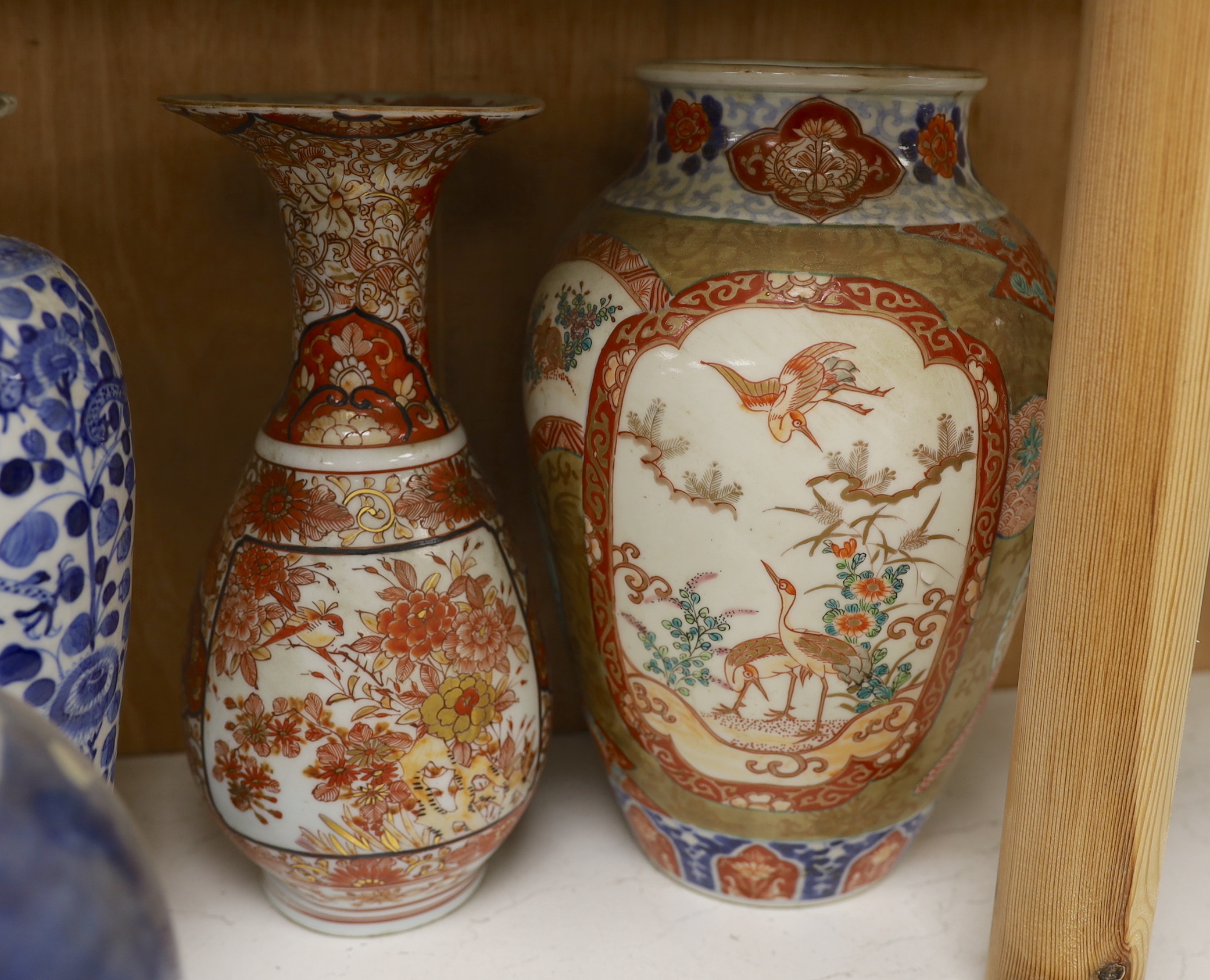 A Chinese blue and white lidded baluster vase, with damage, together with a lidded prunus ginger jar, a Japanese Kutani Export vase, a small blue and white dish (5), baluster vase and cover 27.5 cm high